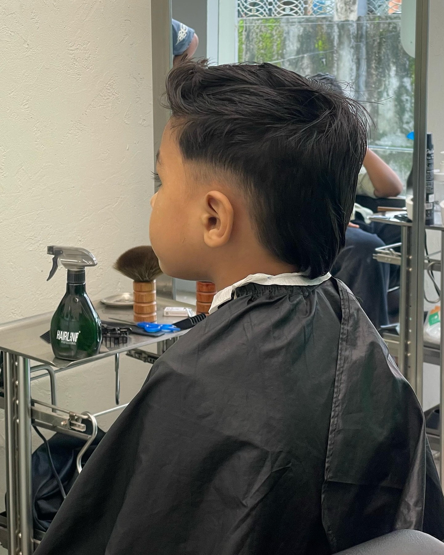 Kid being cut, side profile