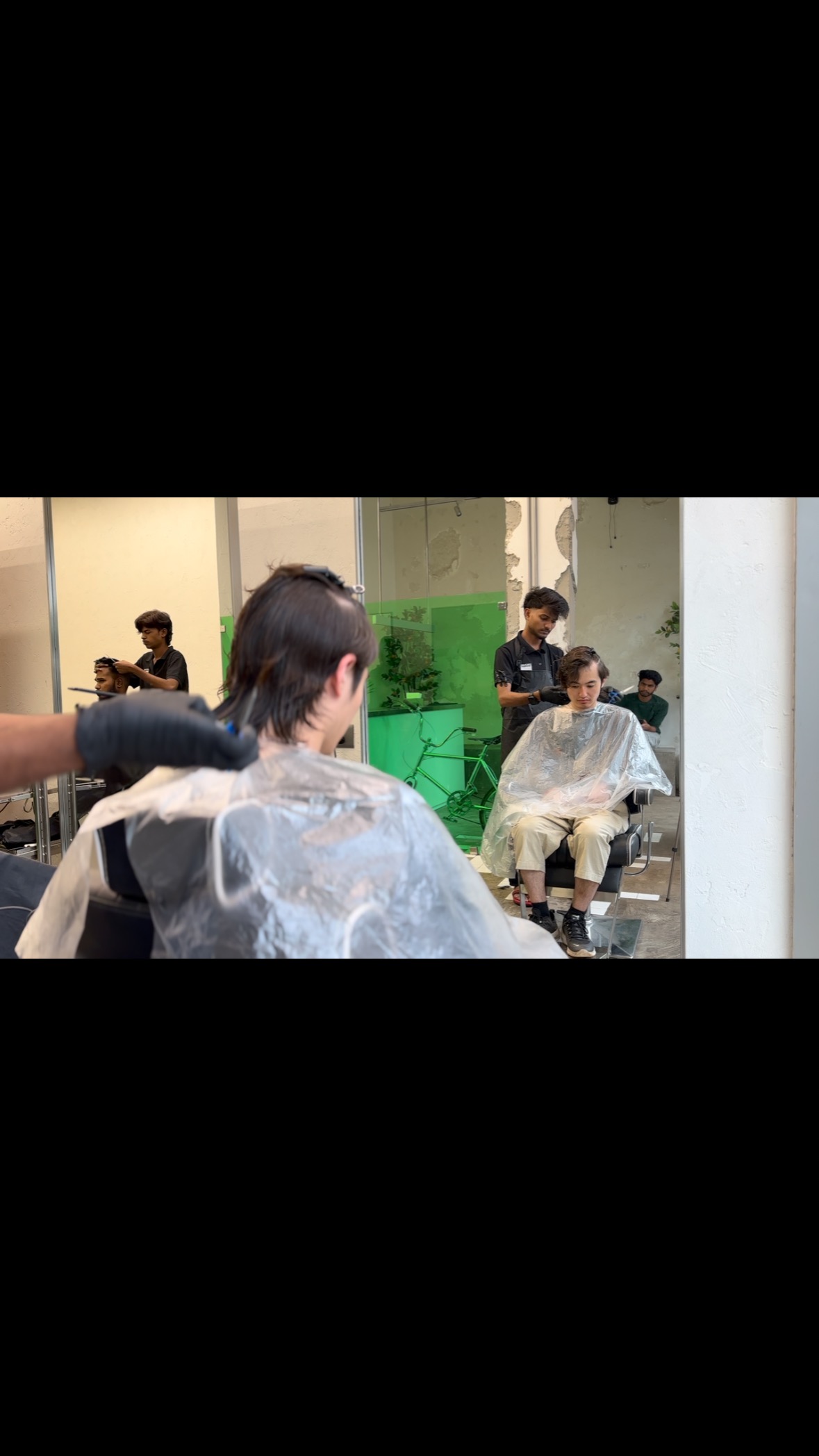 Cromen Barber shop wide shot, mirrors and chairs